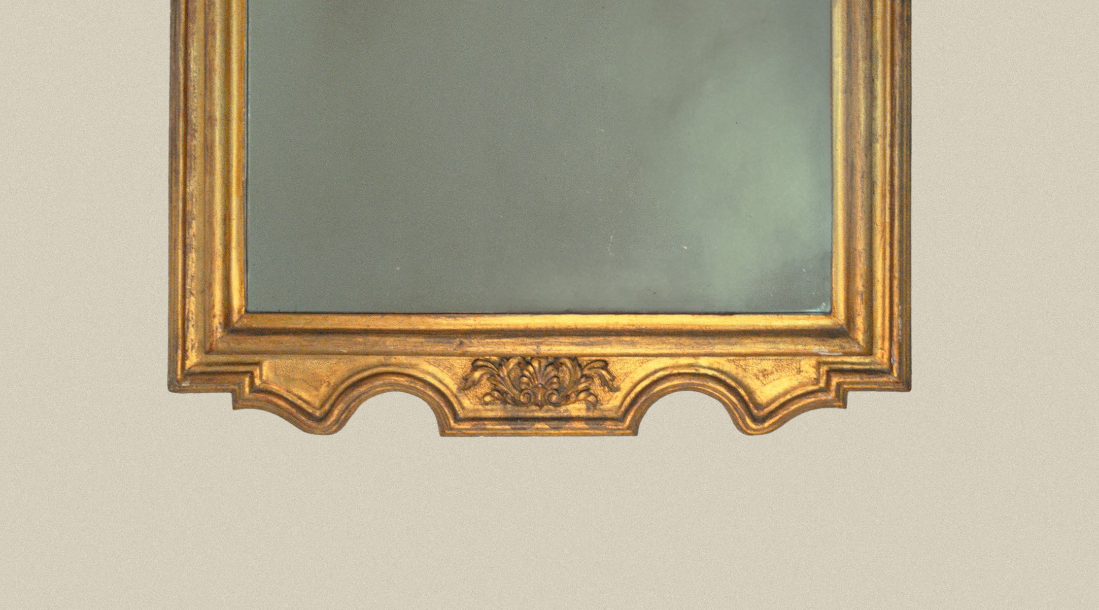 Specchiera in legno scolpito e dorato